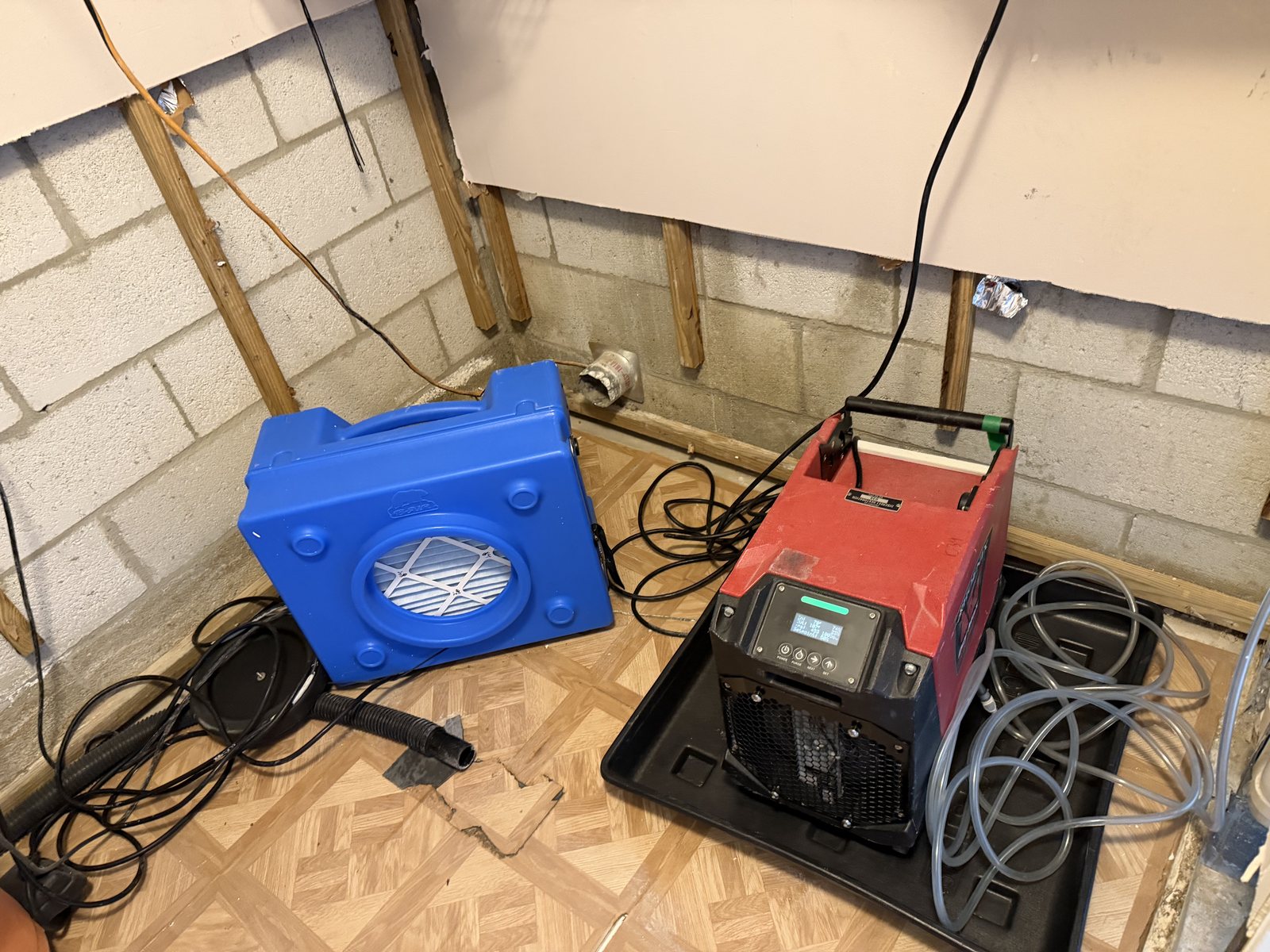 HEPA air scrubber and dehumidifier drying a Coconut Creek condo after mold removal